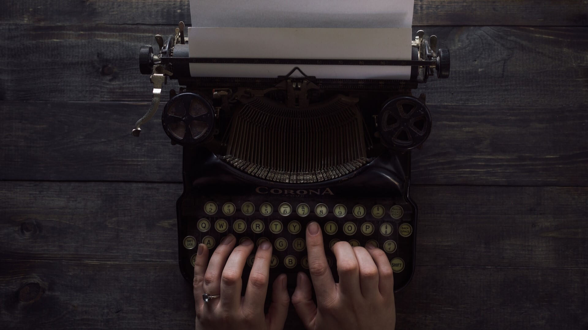 A person who uses a typewriter to write a book
